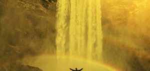 image of a man in a rainbow below a waterfall showing six sources of inspiration for charity digital teams