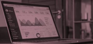 laptop screen with charts and figures showing four things holding back online fundraising