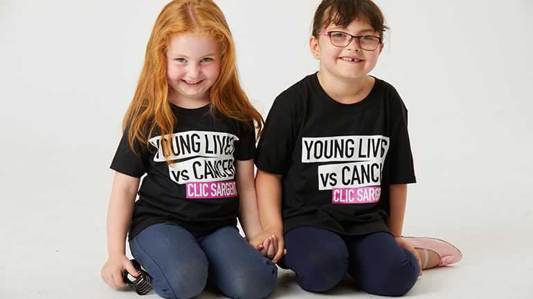 Two children wearing CLIC Sargent T-shirts