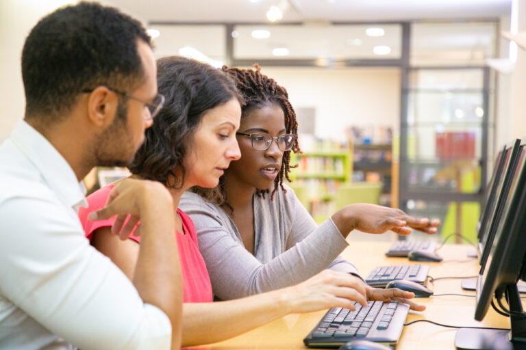 Instructor explaining corporate software specific to trainees