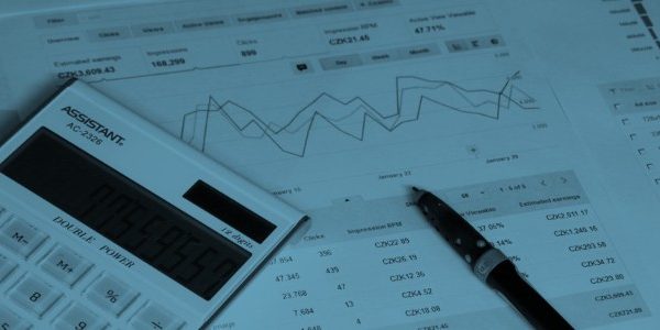 image of papers with charts figures and a calculator to represent the hidden harm of the luddite line